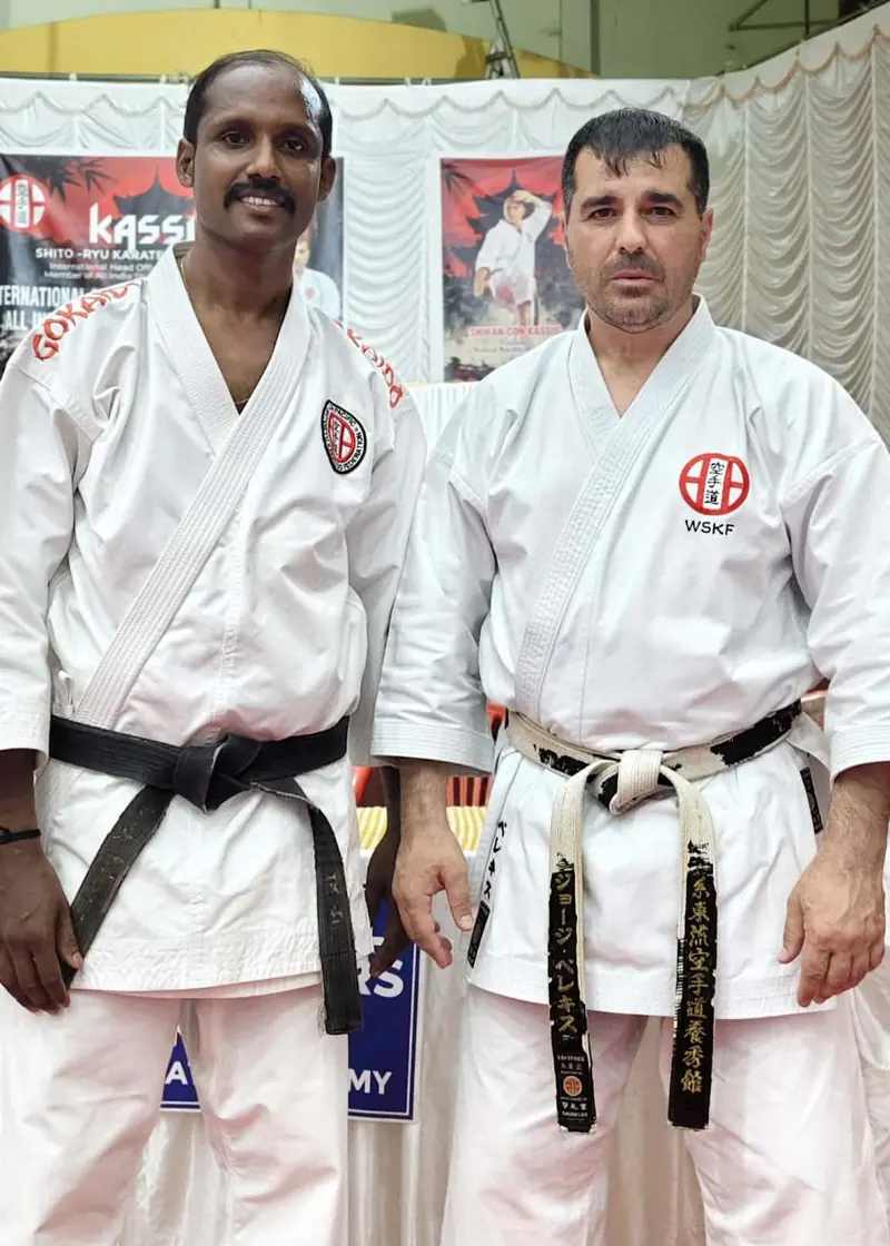 Renshi George Pelekis standing beside a Kassis Karate Academy India black belt